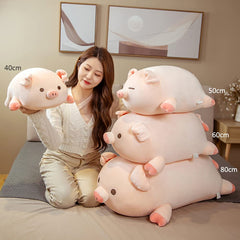 Lannery pig hug pillow doubles as a neck pillow during reading time.
