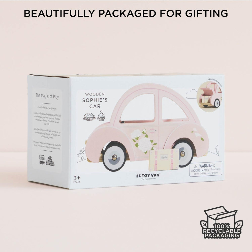 Pink Sophie's car with luggage enhances coordinated play across rooms.