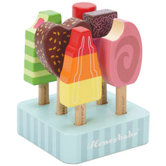 Le Toy Van Honeybake ice lollies collection on wooden sticks for imaginative play and social interaction.