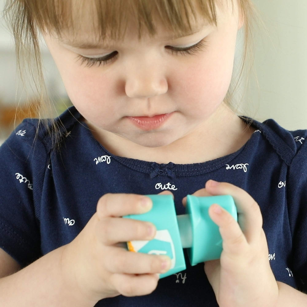 Learning Resources Snap-n-Learn Rainbow Owls tummy-colors-shapes highlights color and shape recognition.