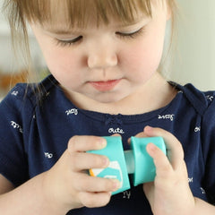 Learning Resources Snap-n-Learn Rainbow Owls tummy-colors-shapes highlights color and shape recognition.