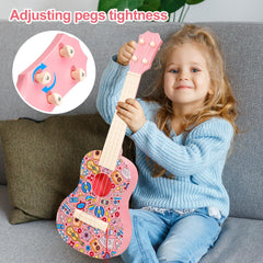 LeeQee 21in graffiti ukulele pink child holding highlights learning-friendly moment