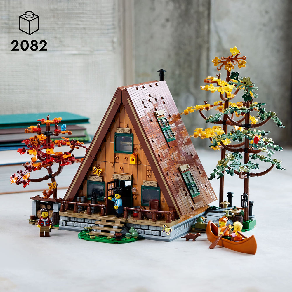 LEGO Ideas A-Frame Cabin interior living area shows kitchenette and study.