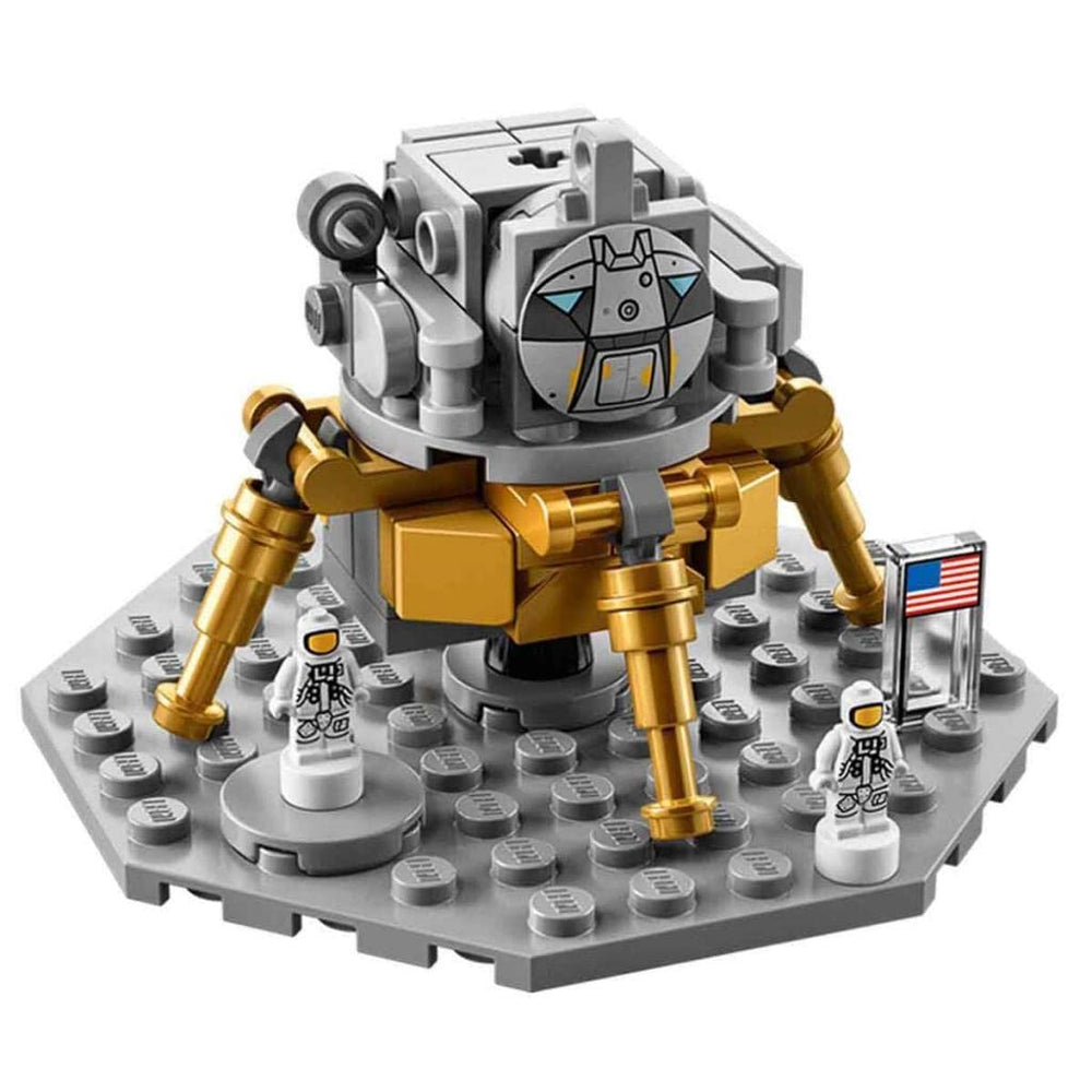 LEGO Apollo Saturn V lunar-module scene with astronauts and flag.