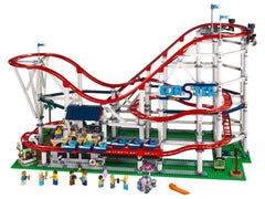 LEGO Creator Expert Roller Coaster station scene with riders and attendants.
