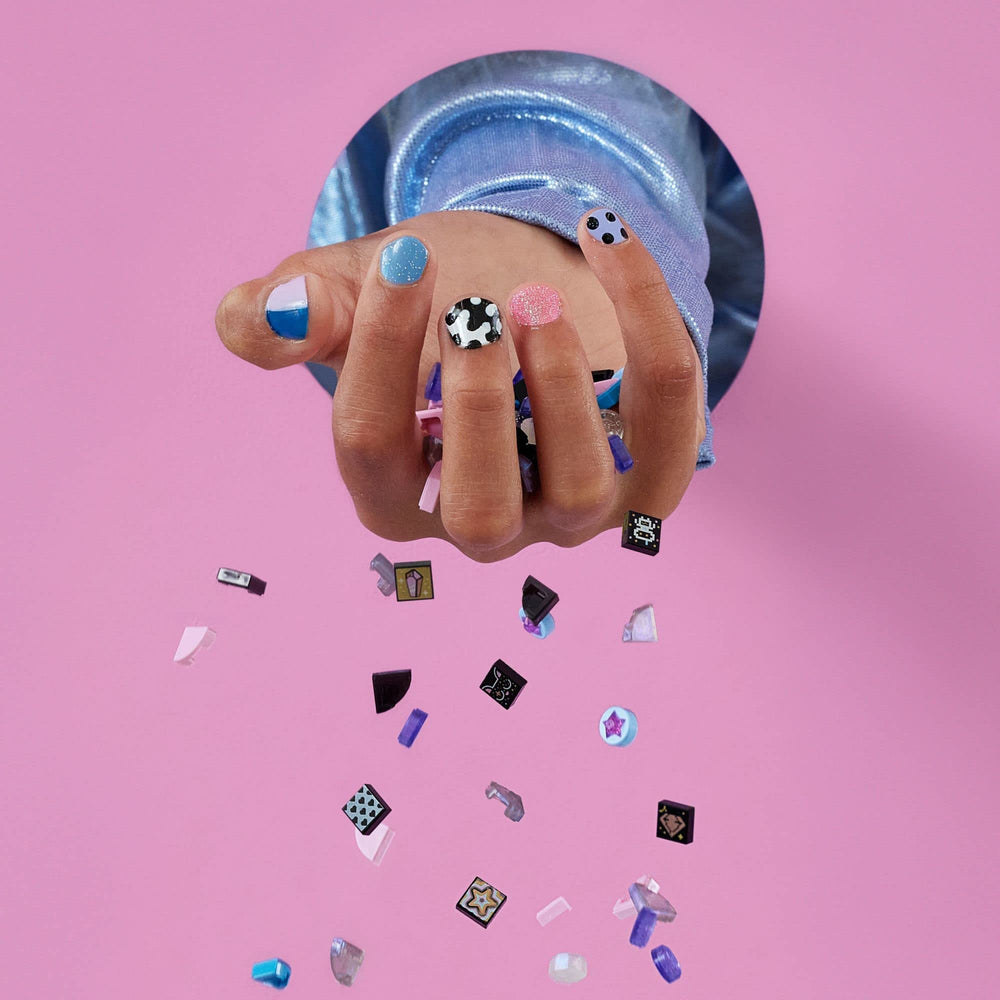 Graphic DOTS tiles featuring music, love, animals, and space designs