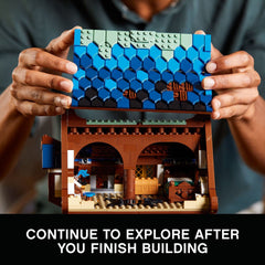 LEGO Ideas Medieval Blacksmith 21325 garden with apple tree and well, adds outdoor charm.