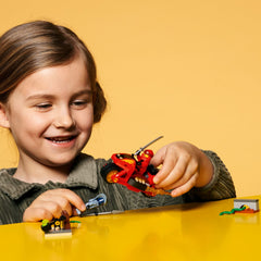LEGO NINJAGO Kai blade cycle in motion shows dynamic ninja vehicle play.