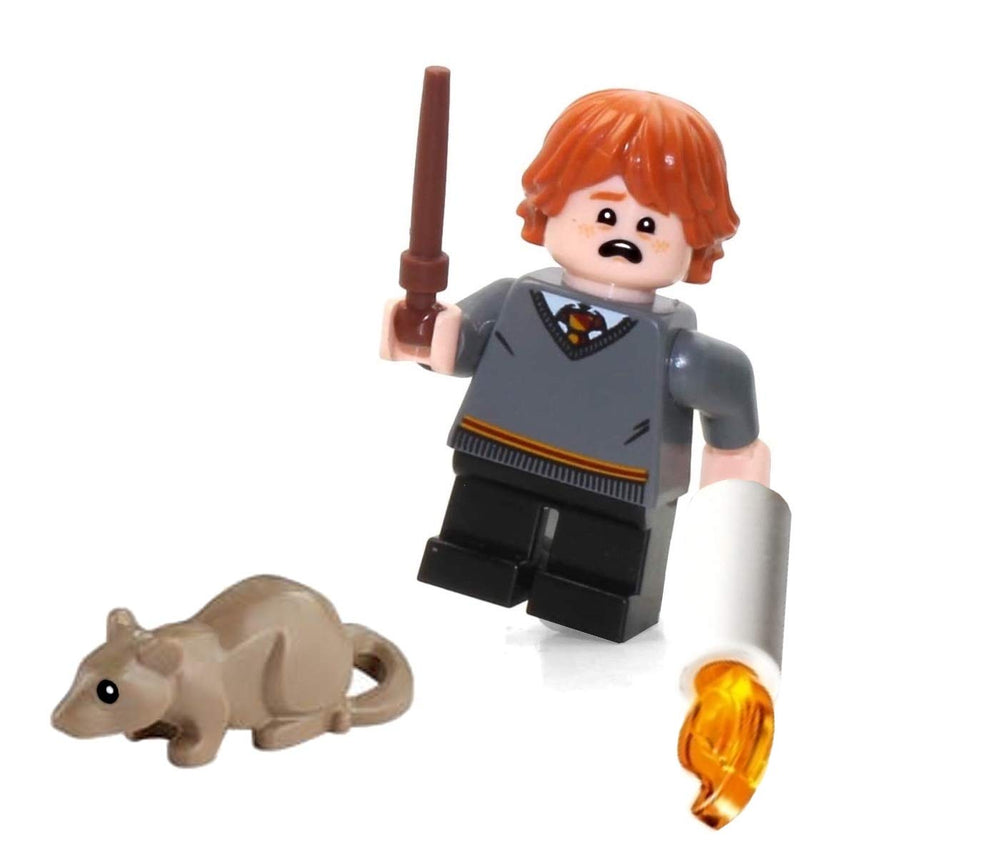 LEGO Ron Weasley figure with wand featured in a Hogwarts diorama setting.