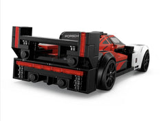 Color scheme of LEGO Porsche 963 76916 in red, black, and white, eye-catching on shelf