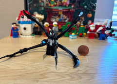 LEGO Spider-Man Venom tile close-up showing authentic Minifigureland detail.
