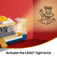 LEGO lantern upper tier folds out to show three mini-scenes: food stall, decorations, shadow theater