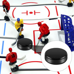 Liliful mini hockey pucks on a game table with black finish
