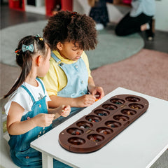 Premium wood material with warm grain in the Lingle Mancala board.