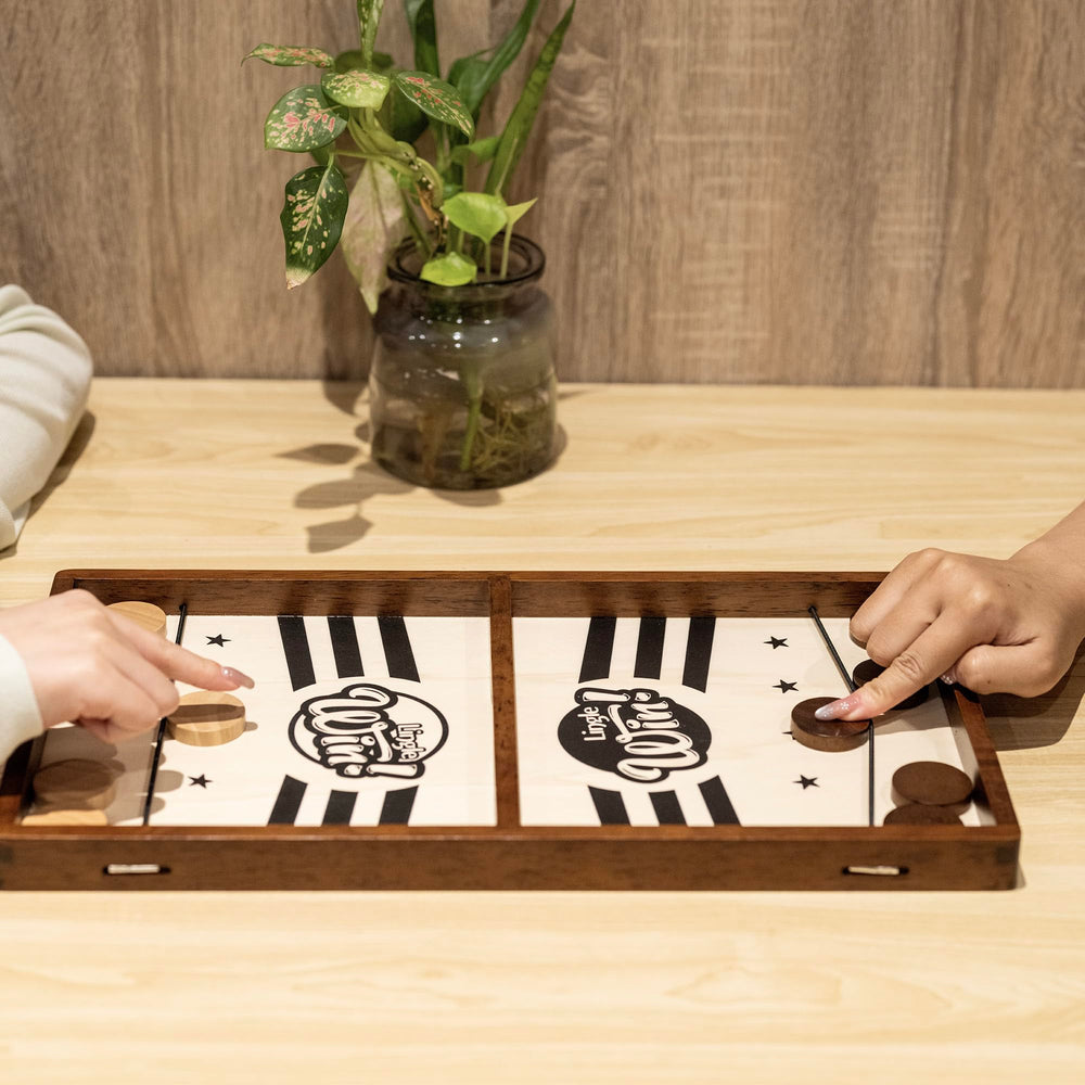 Lingle Sling Puck Game tabletop play fits on desks or coffee tables.