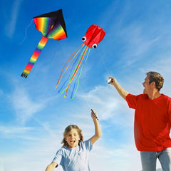 Listenman family and kids flying kites in the park.