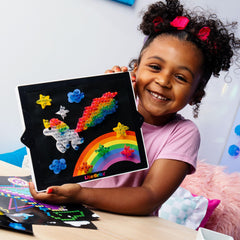 Lite-Brite Classic artwork on the board inspires car rides and quiet afternoons.