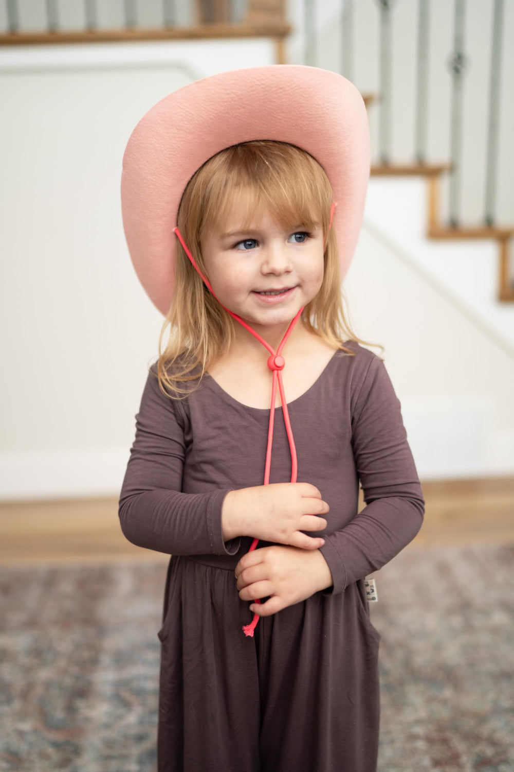 Little Adventures cowboy cowgirl hat flat lay highlighting no itchy fabrics and durability.
