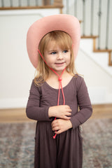 Little Adventures cowboy cowgirl hat flat lay highlighting no itchy fabrics and durability.