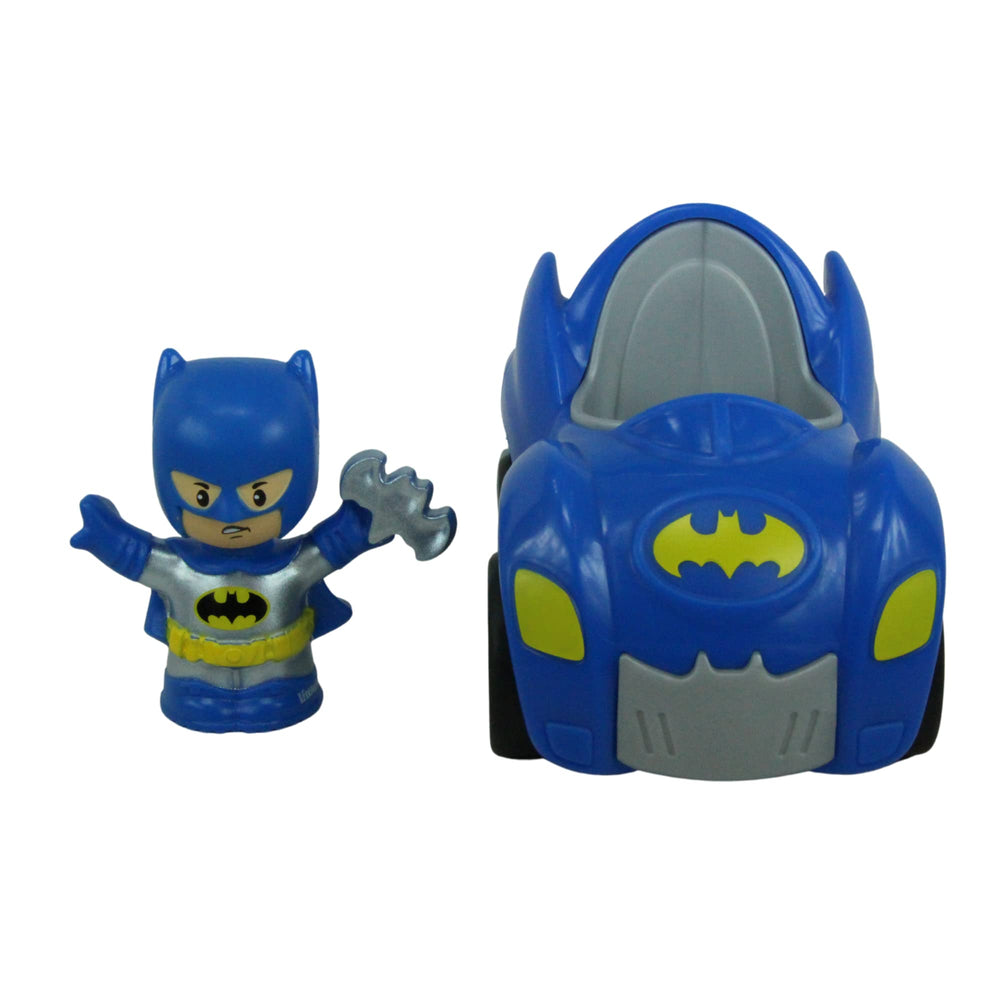 Toddler hands holding Batman figure from Little People DC Super Friends