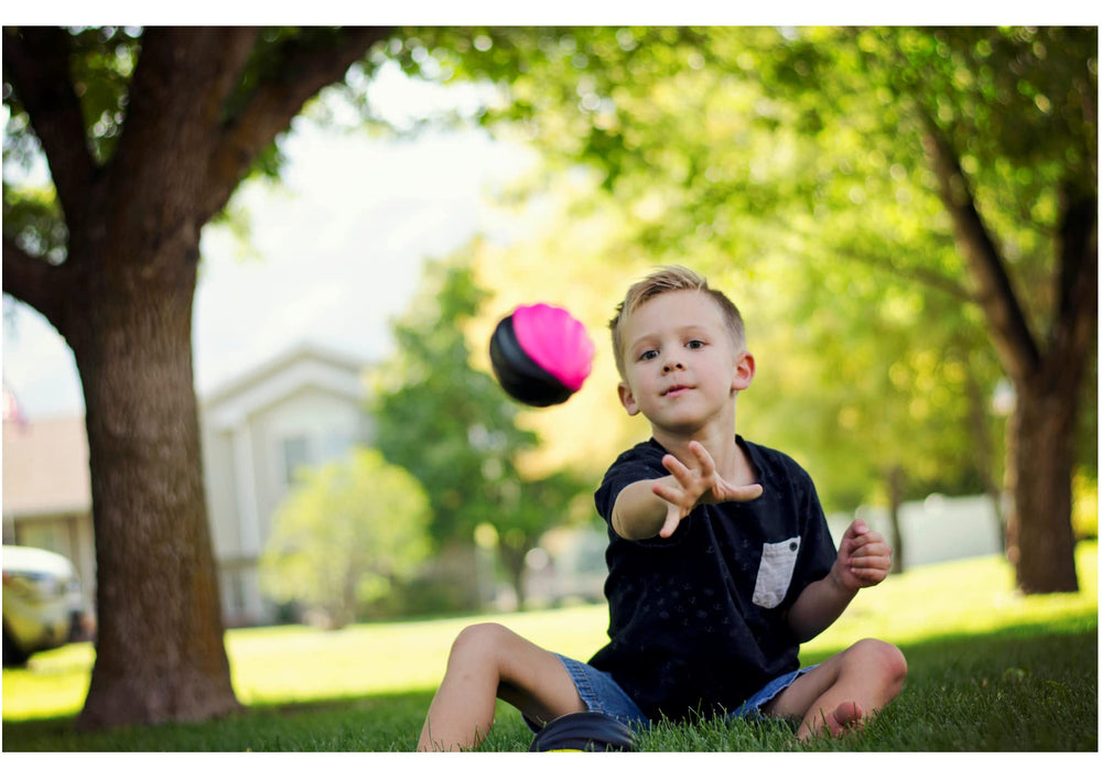 LMC Products mini football in hand, soft grip for easy catching.