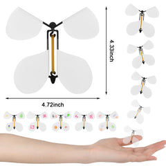 LOMIMOS wind-up butterfly mechanism close-up showing durable rubber band