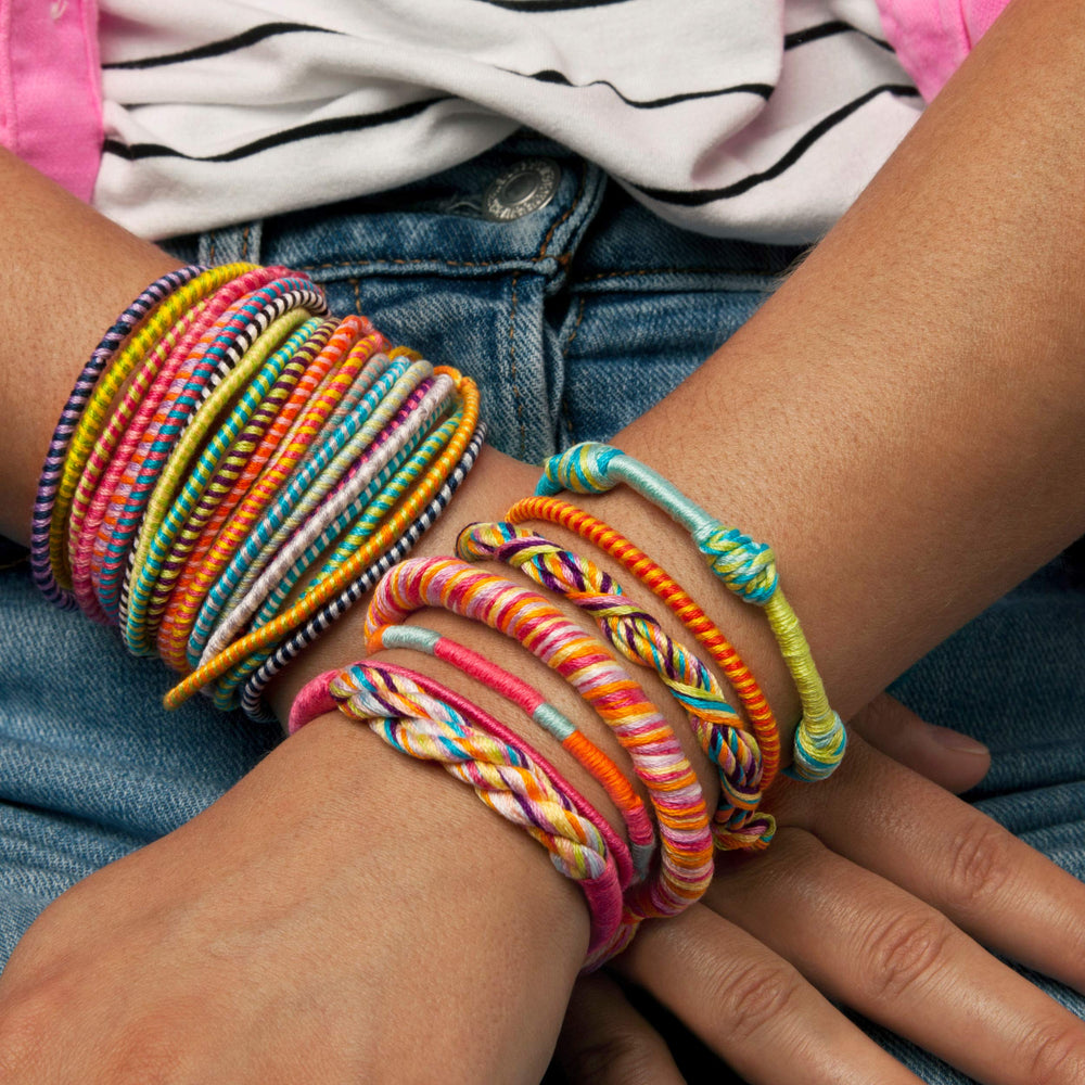Loopdedoo used by a child to craft personalized bracelets.