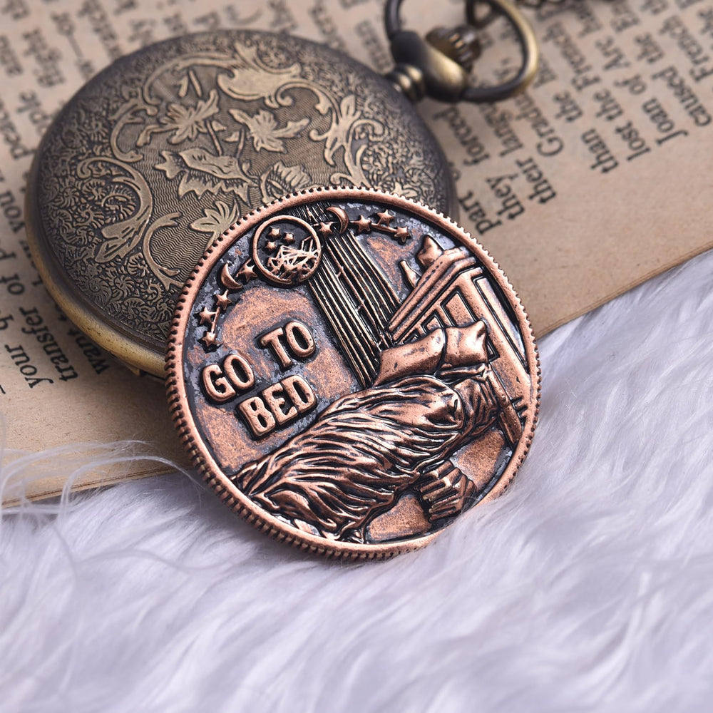 LParkin Just One More Chapter coin in hand evokes cozy reading rituals.