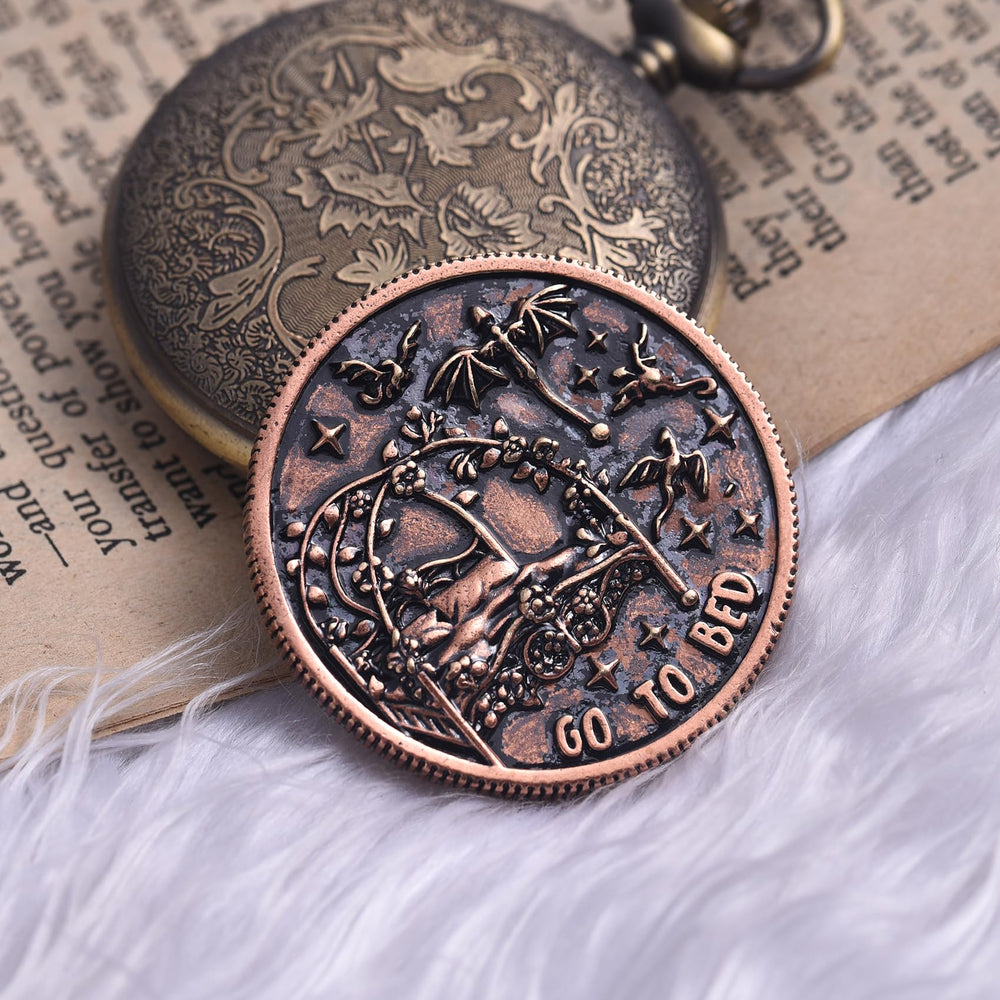 LParkin Just One More Chapter Coin beside a notebook for cozy reading moments.