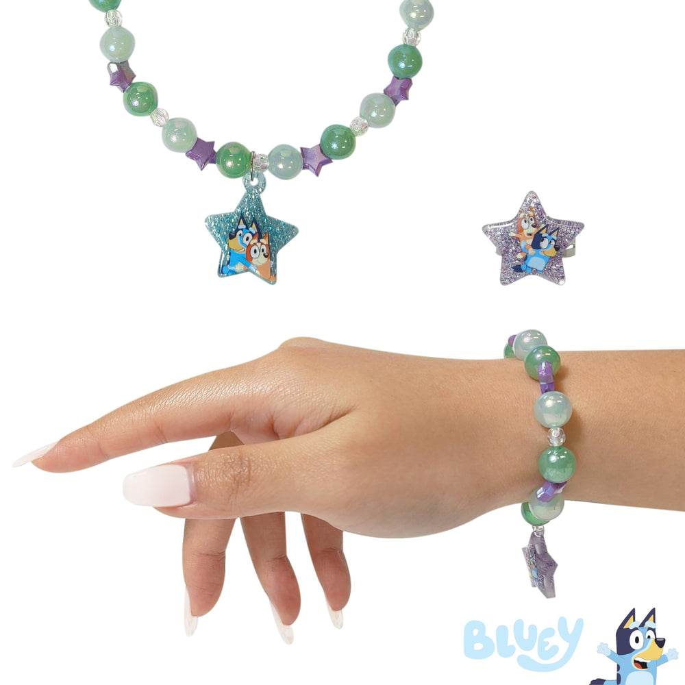 LUV HER emblem detail on necklace and bracelet design.