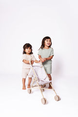 Beige and white floral print adds elegance to pretend play sets.
