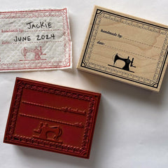 Madam Sew handmade-by stamp offers personalized labels on fabric.
