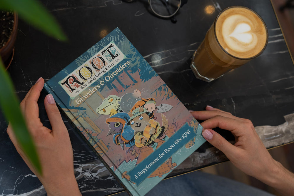Magpie Games Root Travelers & Outsiders hardcover features silk bookmark for durable reference