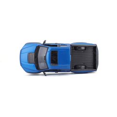 Maisto Ford F-150 Raptor blue scale 1:24 on display shelf.