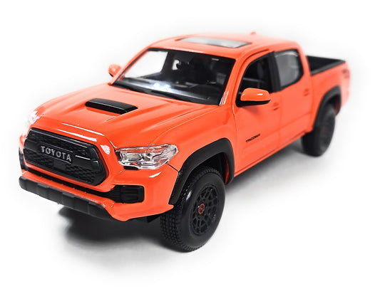 Maisto Tacoma TRD Pro in Solar Octane Orange, front view, ideal for collectors and shelf display.