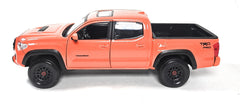 Maisto Tacoma TRD Pro in Solar Octane Orange, side view, adds dynamic detail to diorama setups.