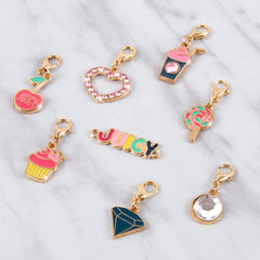 Juicy Couture ear clips add playful detail to creations