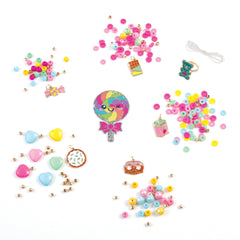 Make It Real Snackers vending machine kit showing bead charms and cords for easy customization.