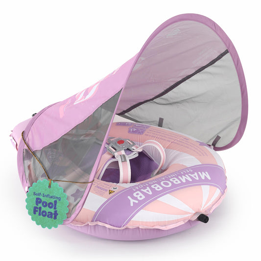 MAMBOBABYFLOAT Light Traveler canopy extended shields baby from sun while swimming.