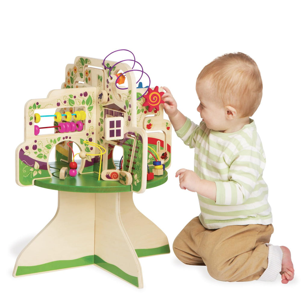 Manhattan Toy Tree Top Adventure spinning dials aid shape recognition.