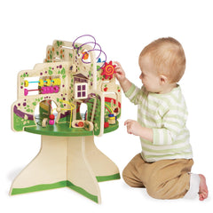 Manhattan Toy Tree Top Adventure spinning dials aid shape recognition.