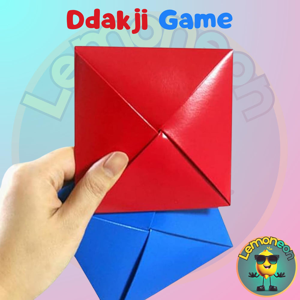 Markhomia Ddakji tiles flip from above, offering engaging skill and friendly competition.