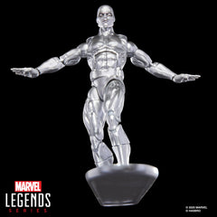 Plastic 1968 Silver Surfer #1 comic book accessory enhances display depth.