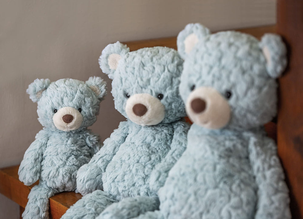 Mary Meyer Putty Seafoam Bear seated with weighted bottom for stable cuddles.