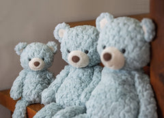 Mary Meyer Putty Seafoam Bear seated with weighted bottom for stable cuddles.
