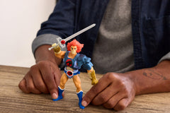 Masters of the Universe Lion-O with Sword of Omens and Eye of Thundera jewel visible.