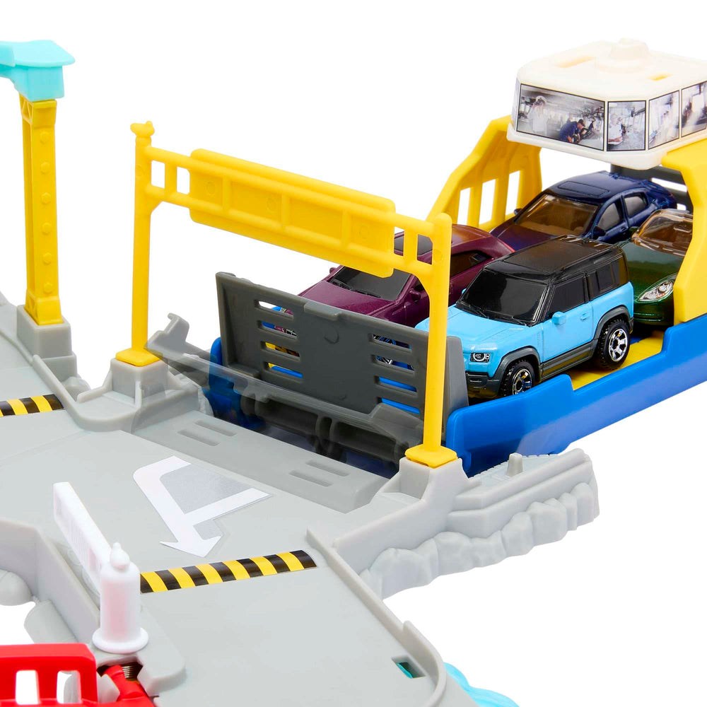 Terminal transport play with cars moving between ports in the Matchbox set.
