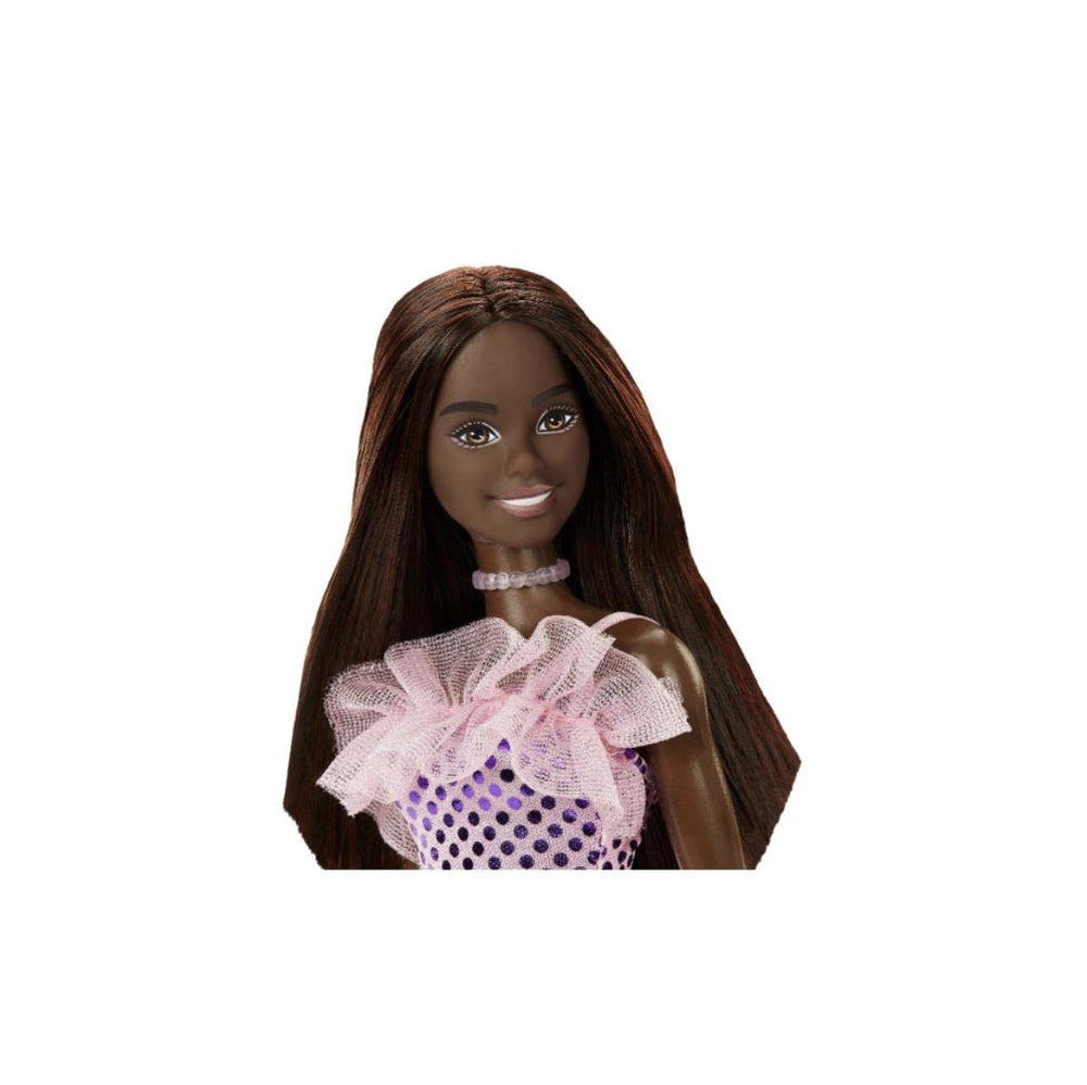 Mattel Barbie doll wearing a matching necklace and slender heels for party-ready storytelling.