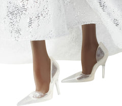 Barbie Signature 2021 Holiday doll features a shimmering tulle peplum and full skirt.