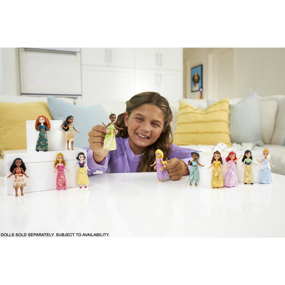 Mattel Belle in yellow gown with iconic styling for pretend fashion.